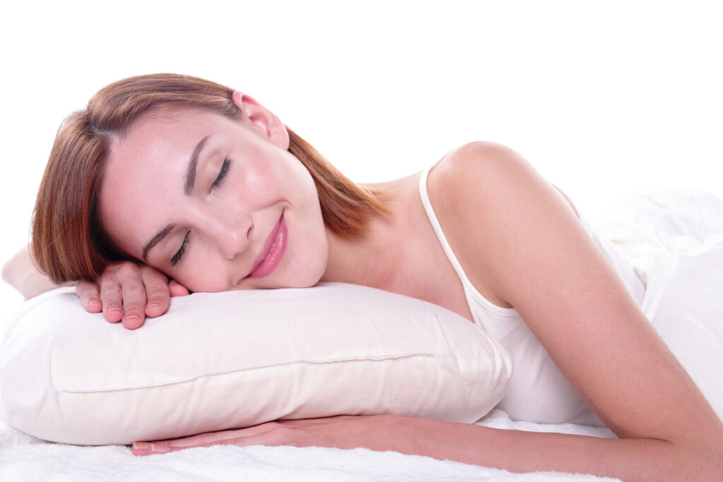 A photo of a young woman blissfully sleeping.